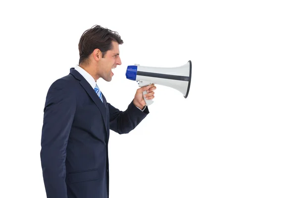 Side view of a businessman shouting on his megaphone — Stock Photo, Image