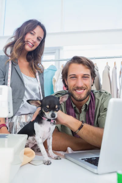 Two fashion designers smiling to the camera — Stock Photo, Image