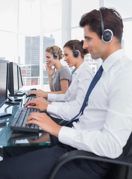 Group of call center employees working in line — Stock Photo, Image