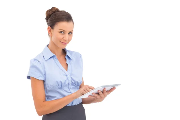 Pretty businesswoman touching digital tablet — Stock Photo, Image