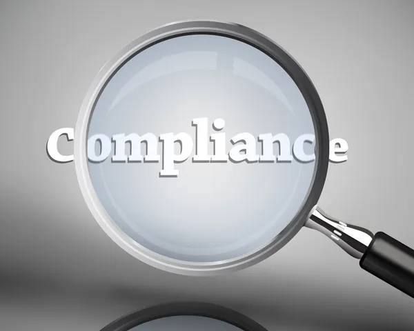 Lupe mit dem Wort Compliance in weiß — Stockfoto
