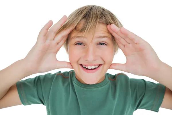 Surpised boy smiling with hands raised — Stock Photo, Image