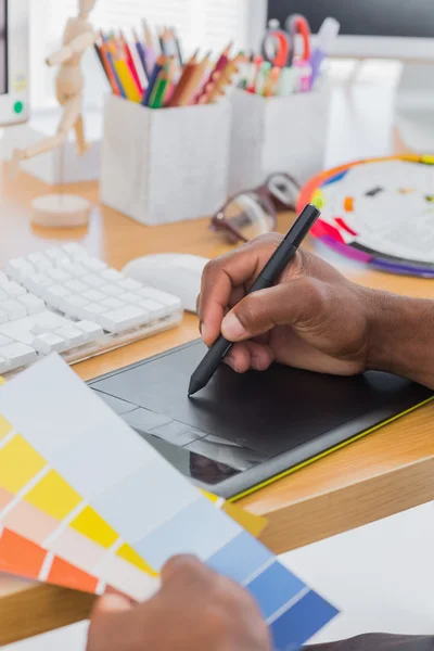 Interior designer with graphics tablet and colour chart — Stock Photo, Image