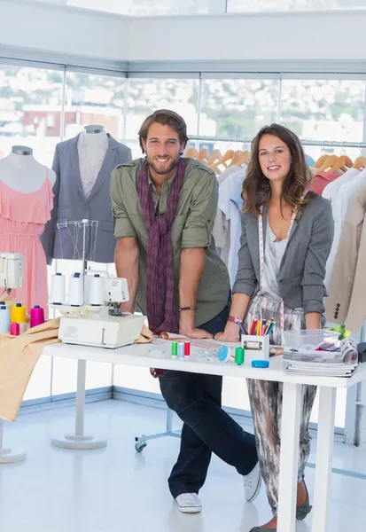 Two fashion designers standing in a bright creative office — Stock Photo, Image