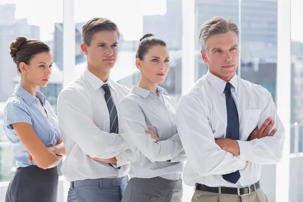 Serious business standing together in line — Stock Photo, Image