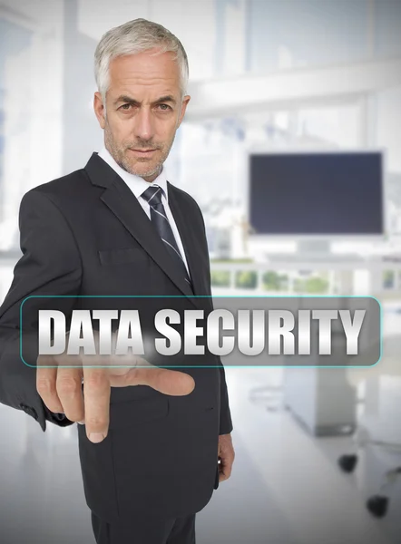 Businessman touching the term data security — Stock Photo, Image