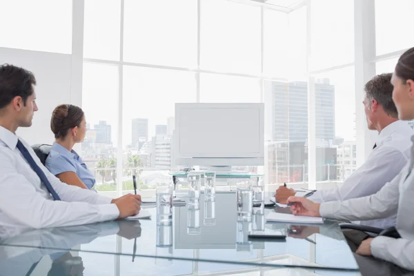 Business looking at a blank whiteboard — Stock Photo, Image