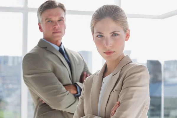 Serious business standing with their arms crossed — Stock Photo, Image