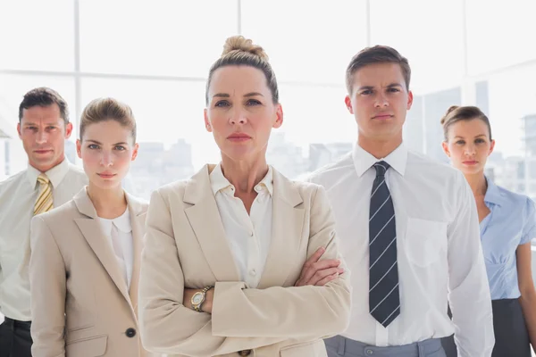 Group of serious business team standing together — Stock Photo, Image