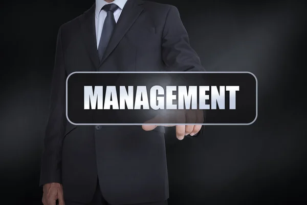 Businessman pressing the word management — Stock Photo, Image