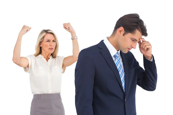 Anxious businessman and cheering businesswoman — Stock Photo, Image