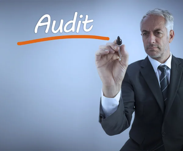 Businessman writing the word audit — Stock Photo, Image