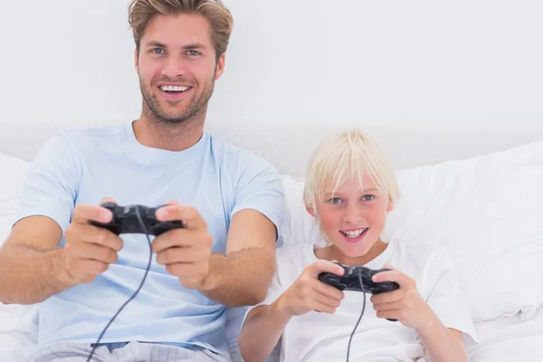 Father and son having fun playing video games — Stock Photo, Image