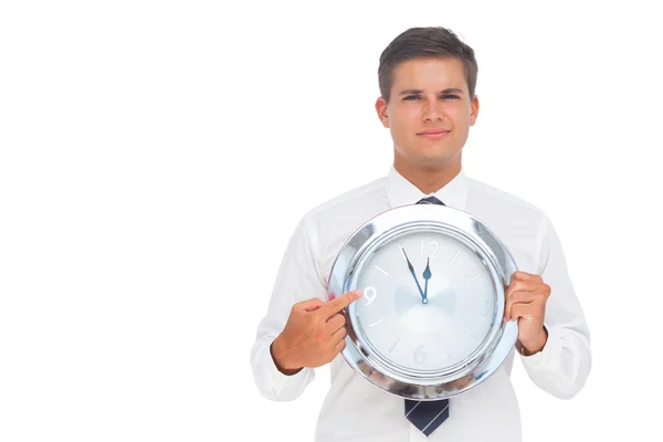 Businessman holding a clock — Stock Photo, Image