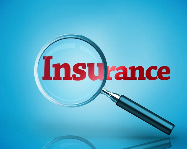 Magnifying glass revealing the word insurance written in red — Stock Photo, Image