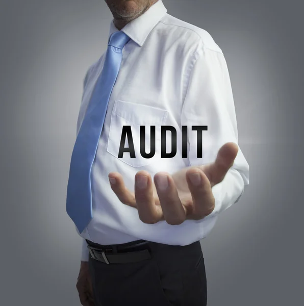 Businessman holding the word audit — Stock Photo, Image