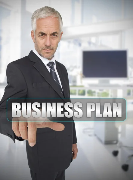 Businessman touching the term business plan — Stock Photo, Image