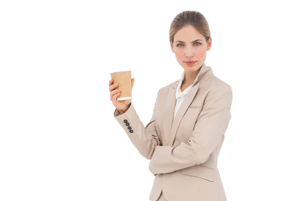 Businesswoman looking at the camera with coffee cup Royalty Free Stock Images