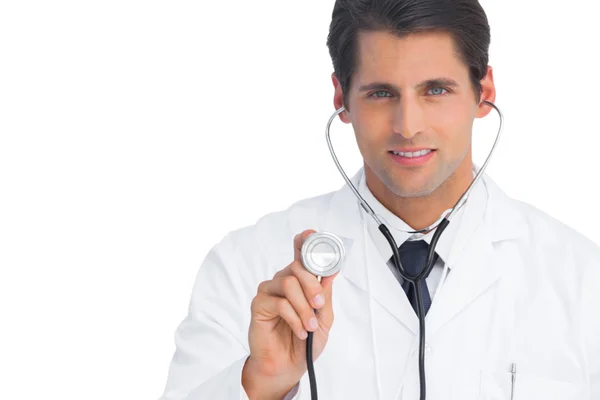 Doctor holding up stethoscope Stock Picture