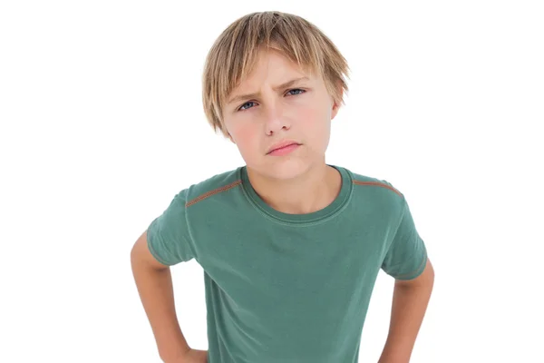 Furious little boy looking at camera Stock Picture