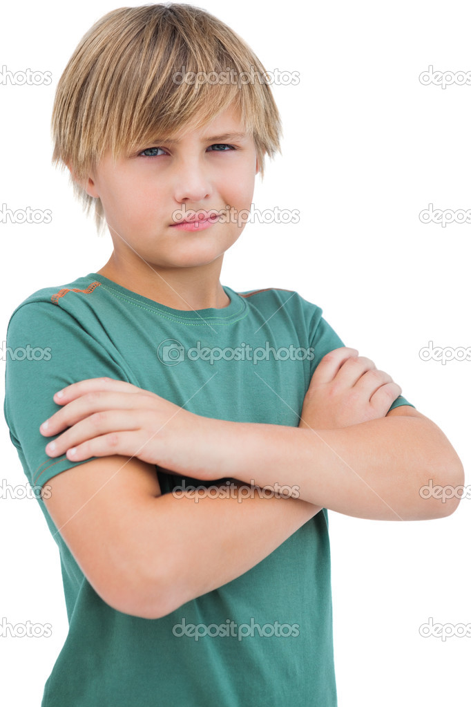 Blonde boy with arms crossed.