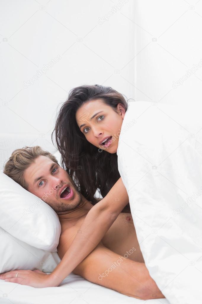Embarrassed Couple In Undergarments Stock Photo - Download Image