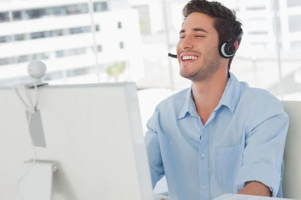 Happy designer laughing during an online communication — Stock Photo, Image