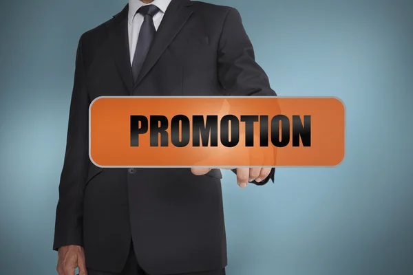 Businessman touching the word promotion — Stock Photo, Image