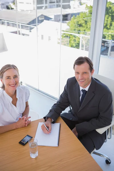 Overhead of cheerful business taking notes — Stock Photo, Image