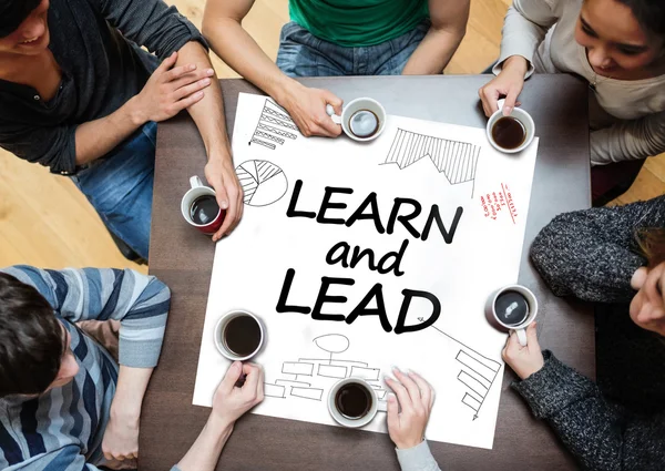 Learn and lead written on a poster with drawings of charts — Stock Photo, Image