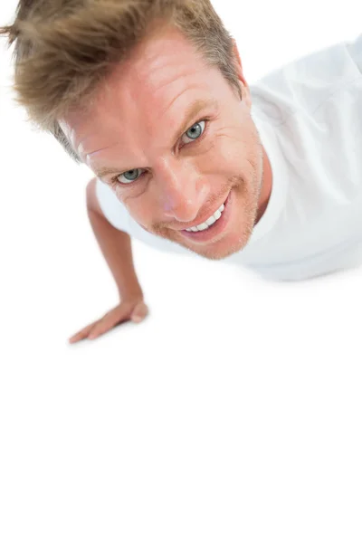 Hombre haciendo ejercicio flexiones — Foto de Stock