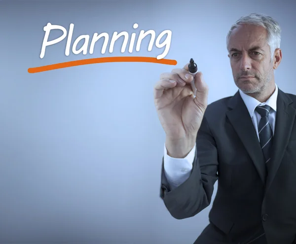 Businessman writing the word planning — Stock Photo, Image