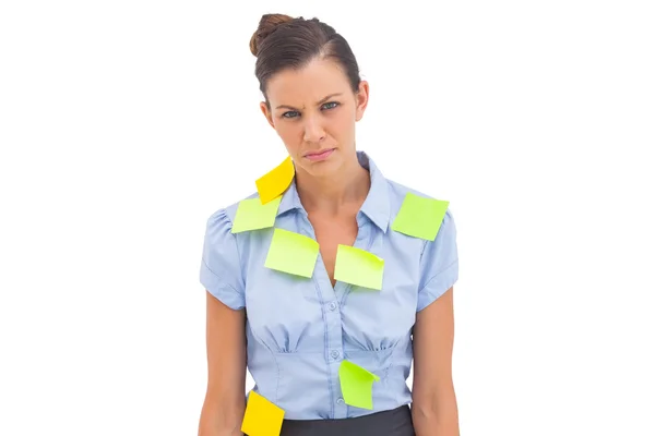 Upset businesswoman with adhesive notes — Stock Photo, Image