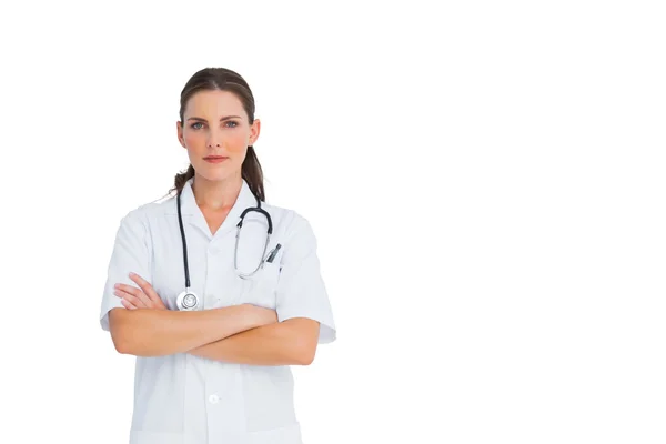 Unsmiling nurse with arms crossed — Stock Photo, Image