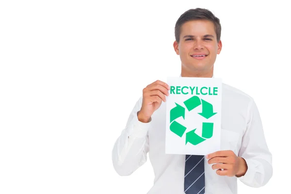 Businessman showing a paper with environmental awareness sign — Stock Photo, Image