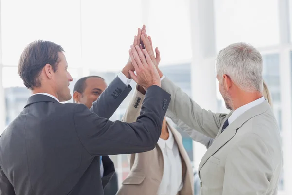 Business team high fiving — Stock Photo, Image