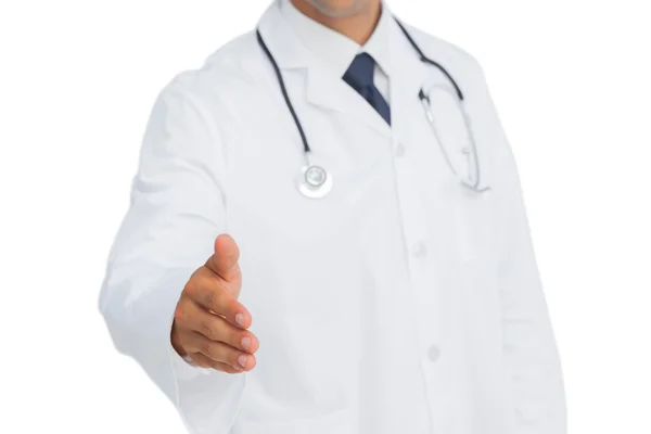 Doctor reaching out for a handshake — Stock Photo, Image