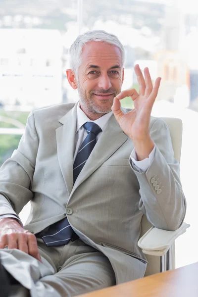 Happy businessman giving ok sign — Stock Photo, Image