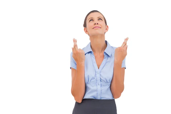 Wishing businesswoman with fingers crossed — Stock Photo, Image