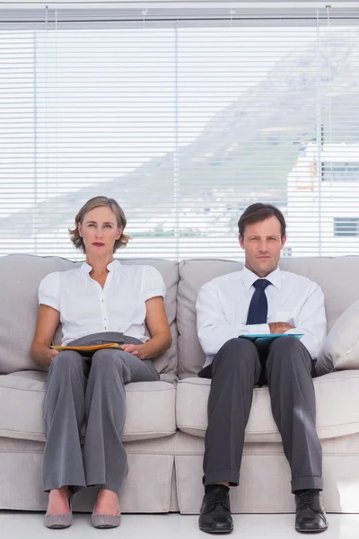 Stern business sitting on couch — Stock Photo, Image