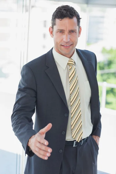 Businessman offfering hand for handshake — Stock Photo, Image