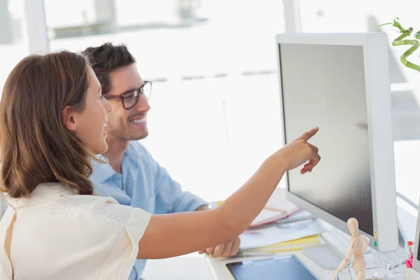 Attractive photo editor pointing at the screen — Stock Photo, Image