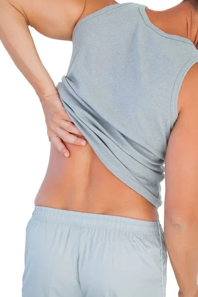 Man in tank top suffering from lower back pain — Stock Photo, Image