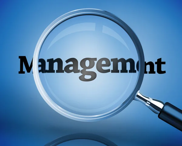 Magnifying glass above the word management — Stock Photo, Image