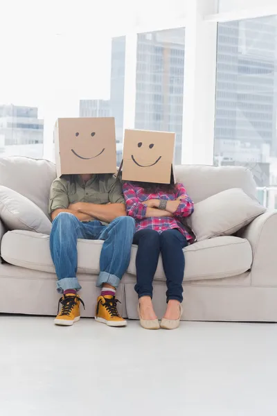 Funny workers wearing boxes on their heads — Stock Photo, Image