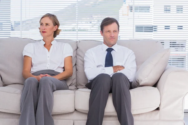 Two bored business sitting on couch — Stock Photo, Image