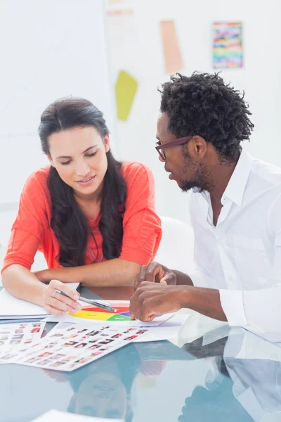 Two designers working on a colour wheel — Stock Photo, Image