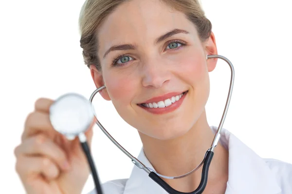 Smiling nurse using stethoscope — Stock Photo, Image