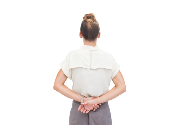 Businesswoman with hands behind her back — Stock Photo, Image