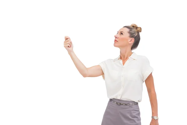 Businesswoman holding her hand and looking up Stock Picture
